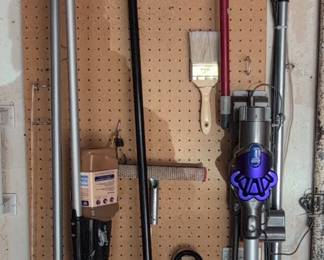 Dyson V Animal Cordless Vacuum Cleaner and assorted household tools