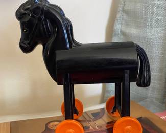  a vintage hard plastic Rosbro Halloween Trojan Horse candy container pull toy from the 1950s