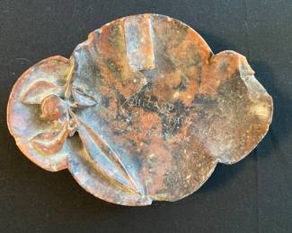 a vintage hand-carved soapstone dish, likely from China, featuring floral or botanical carvings and an inscription related to a "Chicago World's Fair"