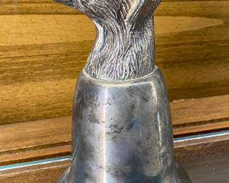 a silver-plated dog head stirrup cup, a traditional hunting-themed collectible