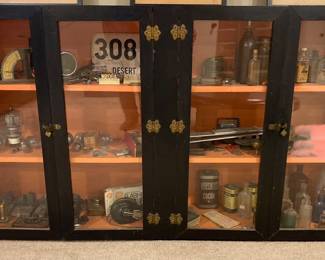 Vintage hand-crafted black cabinet with pink interior