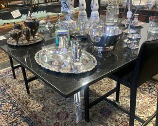 Granite top dining table with Lucite base, Silver plate serving pieces