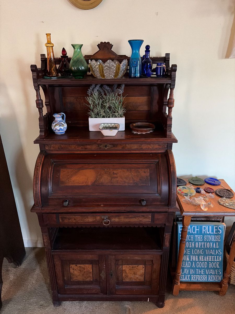 Small antique roll top with the gallery hutch very unusual. Come take a look.