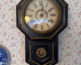 Octagon regulator style wall clock with pendulum window