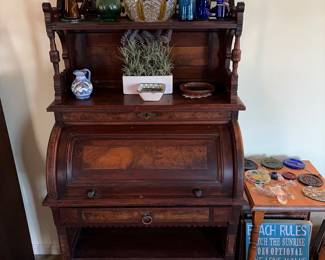 Small antique roll top with the gallery hutch very unusual. Come take a look.
