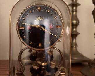 Brey candlesticks an anniversary Clock