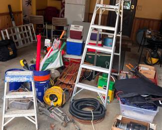 Full garage, ladders, jack, winch, coolers, sleds, misc