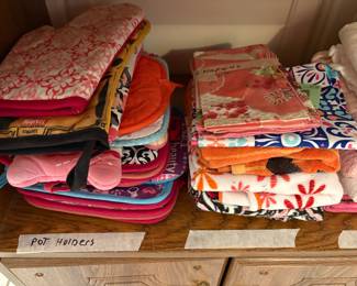 Kitchen - close up of pot holders, towels in cabinet