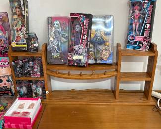 Top of stereo - lots of Dolls and shelf