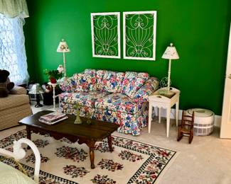 Sitting room Chintz sofa, stands, lamps.