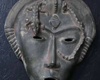Large Latin Ameri an terra cotta mask.