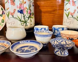 Collection of Chinoiserie and Grandmillennial-style porcelain items, Sweet Pea Ginger Jar Lamps, Rice Grain Porcelain Bowls, Blue Willow Saucer