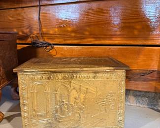 Antique embossed brass fireplace box, often used as a coal box, log bin, or kindling chest