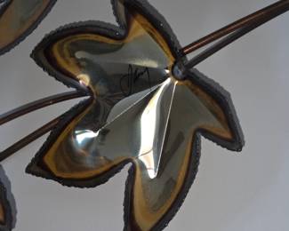 hard to see with the shadows but it is signed.