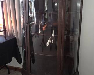 Stunning curved glass cabinet with great head carving