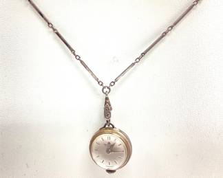 VTG. BUCHERER LADIES SILVER ORB COCKTAIL WATCH THIS SWISS MADE 17 JEWEL SKELETON BACK ORB PENDANT WATCH IS IN 800 SILVER CASE WITH 28 INCH 800 SILVER CHAIN. THE WATCH MECHANISM IS RUNNING.