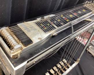 VTG. EMMONS PUSH-PULL SD10 PEDAL STEEL SLIDE GUITAR, 6 PEDAL & 3 KNEE LEVERS, SOLID HARD MAPLE BODY w GLOSS LAMINATE FINISH. THIS GUITAR WAS PROCURED FROM THE BUCK OWENS ESTATE IN CALIFORNIA. IT WAS PLAYED BY JAY MCDONALD OF THE FAMOUS BUCK OWENS BUCKAROOS BAND, BAKERSFIELD, CA. THE PEDAL STEEL GUITAR WILL NEED A TUNE UP. EMMONS LABEL HAS BEEN REPLACED WITH A HARLEY DAVIDSON BADGE. COMES WITH 2 CHROME TONE BARS AKA SLIDES & PICKS