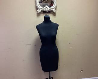 LADIES BUST AND HANGING, TABLETOP MIRROR Adjustable mannequin bust and 1940s Syroco Wood wall mirror featuring a detailed rococo-style foliate frame with sweeping leaves and an off-white painted finish. No shipping Pickup only