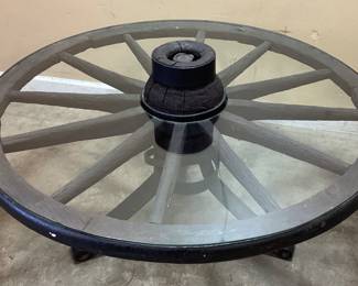 Antique wagon wheel table with glass Custom wagon wheel round table. Approx. 42 in diameter.