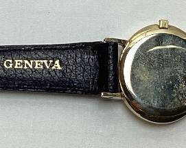 ROLEX GENEVE 14KT YELLOW GOLD LADIES WRISTWATCH, 17 JEWEL SWISS MOVEMENT, BLACK LEATHER BAND, CRYSTAL HAS A SMALL SCRATCH, GOOD WORKING CONDITION, WITH GREEN SUEDE ROLEX POUCH
