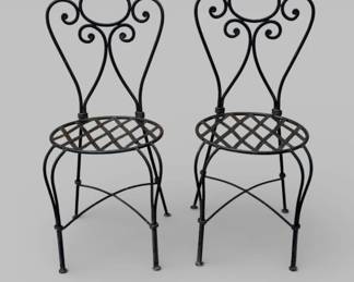 Pair of vintage wrought iron cafe chairs with scroll backs and lattice seat