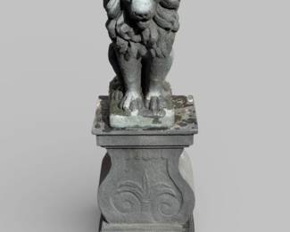 Cast composite lion on pedestal