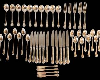 Sterling flatware "Modern Victorian" by Lunt. Set consists of 2 sets of knives (dinner and luncheon). 6 luncheon knives (9"L) and 5 dinner knives (9.5"L), 3 dinner forks (7.5"L), 2 luncheon forks (7.25"L), 7 ice teaspoons (7.25"L), 4 butter spreaders (2 have initials B), 10 teaspoons (6"L) and 10 cream soup spoons (5 with initials "B"). Butter knives weight 107g. Soup spoons weigh 371g. Ice teaspoons weigh 274g. Teaspoons weigh 321g. and forks weigh 276g.