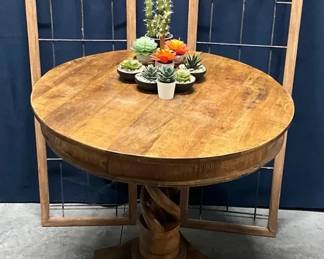 Table with Wall Decor And Cactus