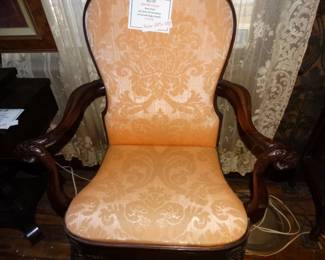 This wonmderful Antique Chaiar hs Curved Arms that terminate in Carved Eagle Heads