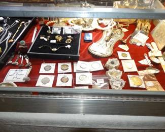 Another case has American Silver Coins, a couple of Texas Coins, a Columbian World's Fair Coin from 1893 - some antique jewelry and loose stones and more!