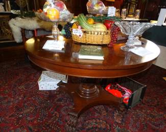 An Antique mahogany Center or Breakfast able on Lg. Single Carved Column and Large Claw Feet Atop is Antique Flint and Lead crystal Compotes