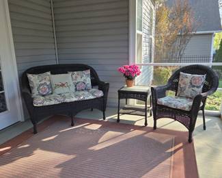 Outdoor wicker settee, table and chair
