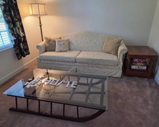 Antique sleigh table, flexsteel couch, end table and floor lamp