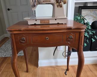 Sewing machine with cabinet