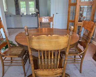 Antique table with four cane chairs