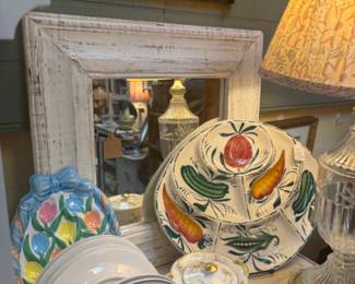 white wood framed mirror, lamps, dishes