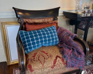 beautiful armchair, throw pillows, throw