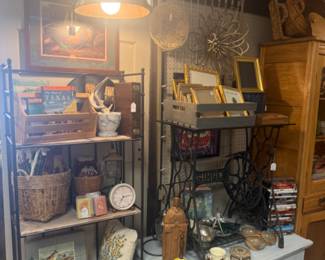 throw pillows, baskets, vintage books and frames, blue side table