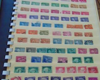 Vintage cancelled stamps in book.