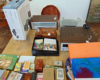 Stereo equipment (other items not shown), playing card s and large square coffee table with mirror base (items sold separately).