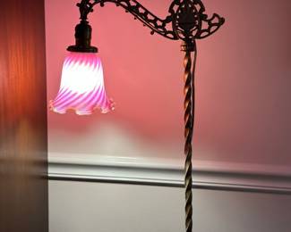 Art  Nouveau bridge floor lamp, rot iron base, Fenton pink swirl shade