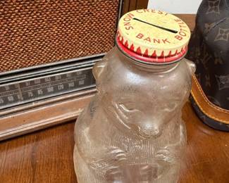 Vintage glass jar coin bank with tin lid