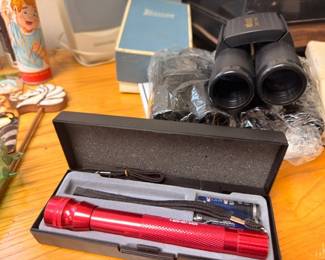 Binoculars in box, red LED flashlight in presentation case, Russian nesting doll