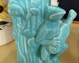 Vintage turquoise art pottery vase with figural sculptural design