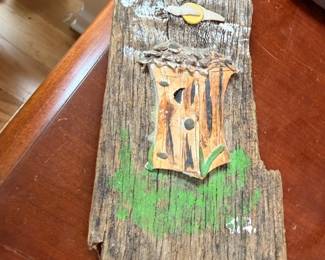 Rustic folk art barnwood plaque with carved cabin scene, signed