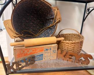 Cast iron skillet, wooden rolling pin, wicker basket, vintage kitchen items