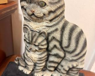 Ceramic tabby cat figurine on wood base, detailed porcelain cat sculpture