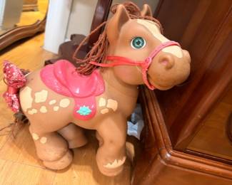Vintage 1980s toy horse with pink saddle