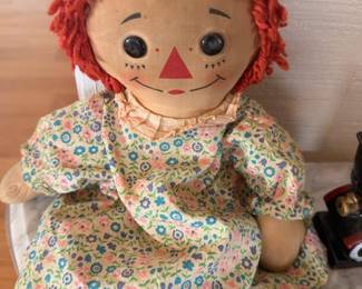 Vintage Raggedy Ann doll in floral dress, collectible rag doll