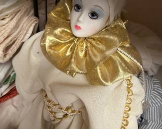 Vintage porcelain harlequin clown doll with gold ruffled collar
